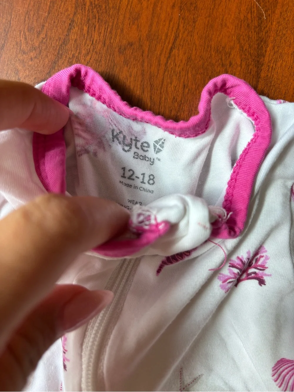 Kyte BABY White Footed One-Piece with Pink Trim & Shell Print
